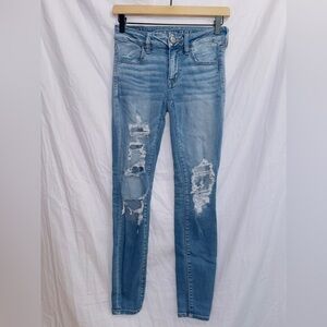 American Eagle Medium Wash Next Level Stretch Mid Rise Distressed Jegging Jean